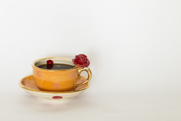 Beautiful handmade orange cup with red rose