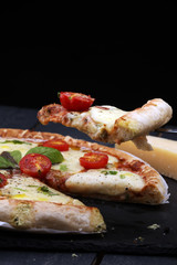 Hot true PEPPERONI ITALIAN PIZZA with salami and cheese. TOP VIEW Tasty traditional pepperoni pizza on board on wooden table with decoration