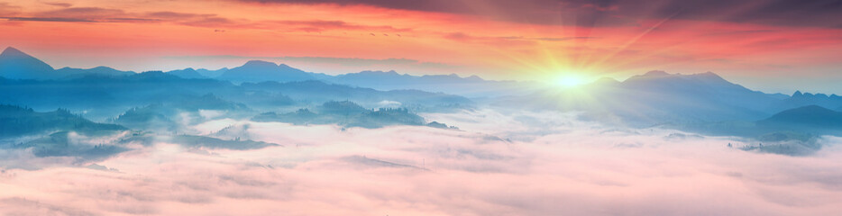 Obraz premium Foggy sunrise in the Carpathian mountains