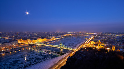 Liberty bridge danube river winter in Budapest night