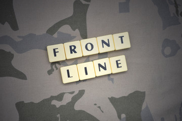 letters with text front line on the khaki background. military concept