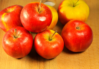 Red apples on wooden table