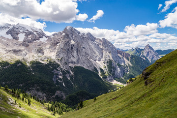 View of the Marmolada, also known as the Queen of the Dolomites and the Fedaia Lake. Marmolada is the highest mountain of the Dolomites, situated in northeast of Italy.