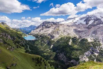 View of the Marmolada, also known as the Queen of the Dolomites and the Fedaia Lake. Marmolada is...