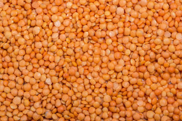 Picture of brown lentils over flat surface for background