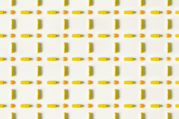 medical pills and capsules pattern on white background. flat lay, top view.
