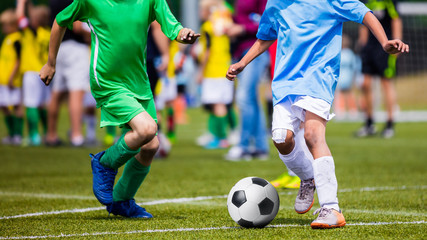 Running Young Soccer Football Players. Footballers Kicking Football Match Game. Youth Soccer...