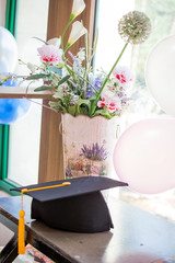 black graduation cap with blurred background.