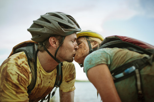 Young couple kissing each other outdoors