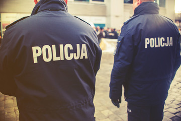 detail of a police (Policja) officer in Poland, demonstration in - obrazy, fototapety, plakaty