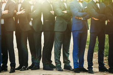stylish confident men in suit standing posing, reception at luxu - Powered by Adobe