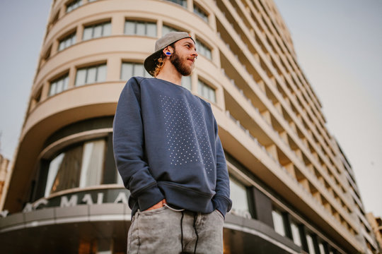 Low angle of young man outside building
