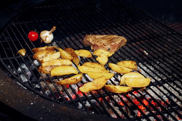 potatos meat garlic and tomato pepper grilling. catering in food