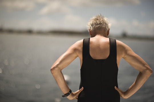 Rear View Of Old Man Wearing Black Singlet.