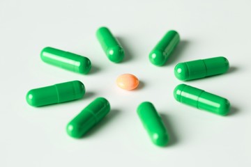 medical pills and capsules pattern on white background. flat lay, top view.