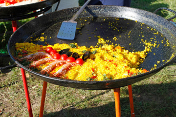 Cooking traditional paella outdoors on a holiday