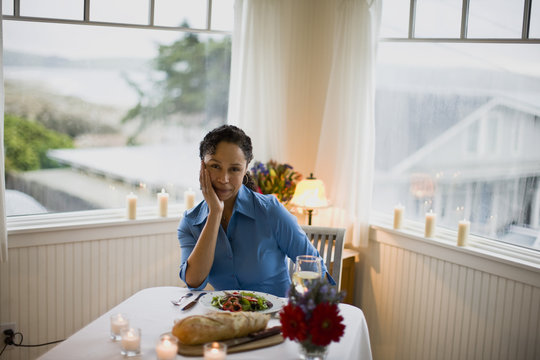 Mature woman alone at dinner time