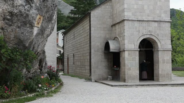 Entrance in building of the Church of the Holy Trinity. The center of courtyard of lower monastery of Ostrog. The monastic residences. Montenegro
