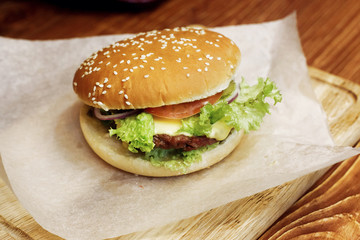 yummy burger. serving cheeseburger or hamburger with salad tomat
