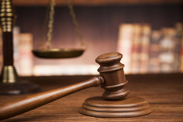 law theme, mallet of the judge, justice scale, books, wooden des
