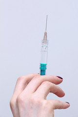Syringe in hand