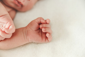 The Part of Body Newborn Baby with Small Touching Hand.Selective