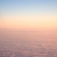 Fototapeta na wymiar Clouds watched from an airplane window