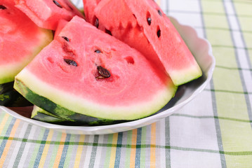 Cut pieces of red watermelon on a plate