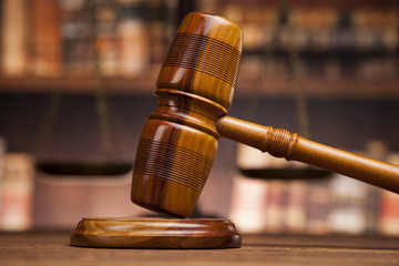 law theme, mallet of the judge, justice scale, books, wooden des