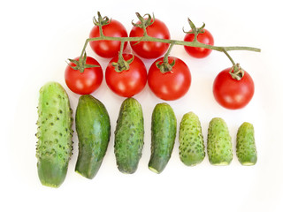 cucumbers and tomatoes isolated on the white