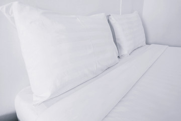 Close up white bedding sheets and pillow