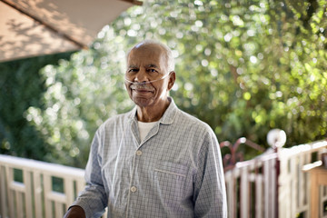 Portrait of elderly man with nasal tubing.