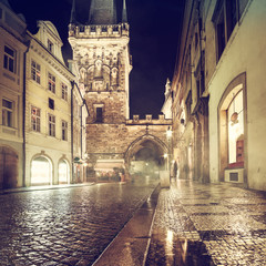 Fototapeta premium Charles Bridge Tower on a rainy night in Prague