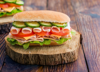 Turkey Ham Sandwich With Cheese, Tomatoes, Cucumbers and Salad