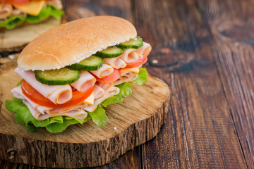 Turkey Ham Sandwich With Cheese, Tomatoes, Cucumbers and Salad