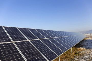 Solar Power Station in the snowy freeze winter Nature