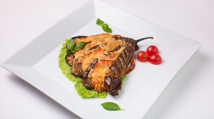 eggplant baked with cheese on white background