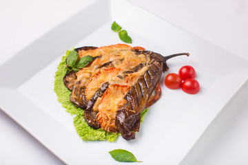 eggplant baked with cheese on white background