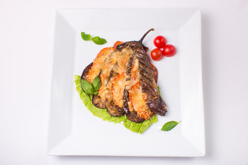 eggplant baked with cheese on white background