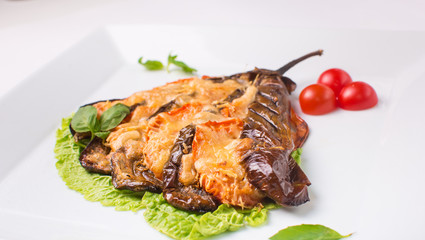 eggplant baked with cheese on white background