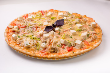 Pizza with cheese, tomatoes and chicken on a white background