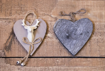 Two vintage interior heart on textured brown board