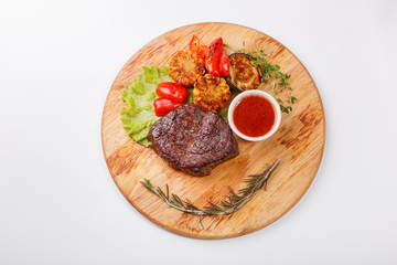 ribeye steak grilled with rosemary on a wooden