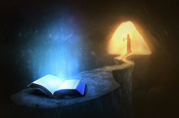 Glowing Bible in cave © Kevin Carden