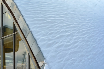 Fototapeta premium Fragment of arched roof with snow