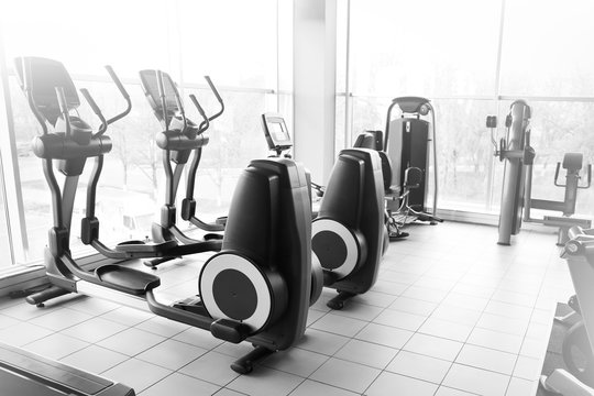 Modern equipment in gym. Black and white photo