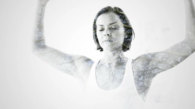 Double exposure of woman practicing yoga