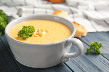 Tasty cornmeal mush with parsley on kitchen table