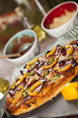 Delicious pizza served on wooden table