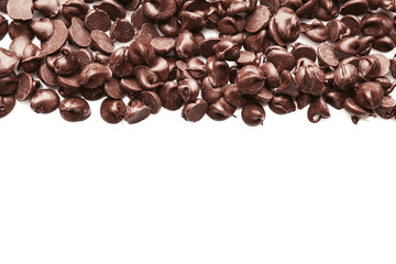 Tasty chocolate chips on white background